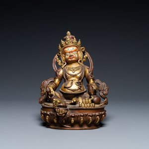 A Sino-Tibetan partly gilt bronze figure of Jambhala with inscriptions on the back, 19th C. — photo 1