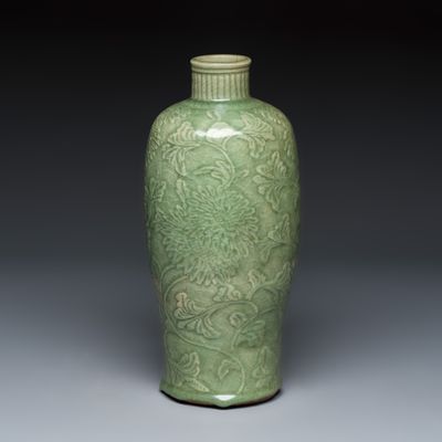 A slender Chinese Longquan celadon 'Meiping' vase with carved floral design, Ming