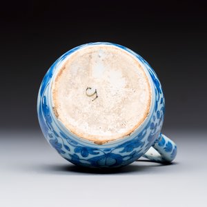 A small blue and white Dutch Delft chinoiserie ewer with figural and floral design — photo 7