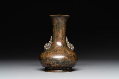 A small Chinese bronze bottle vase with lion-form handles, Qing, 17th C.