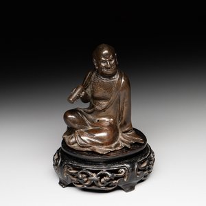 A small Chinese bronze figure of a Luohan, Ming — photo 1