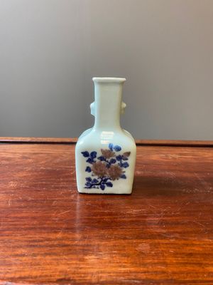 A small Chinese celadon-ground blue, white and copper-red bottle vase, Qianlong mark and of the period — photo 1