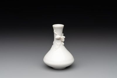 A small Chinese Dehua blanc de Chine 'dragon' bottle vase, Kangxi