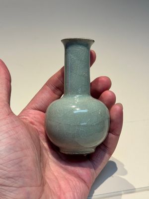 A small Chinese Guan-type Longquan celadon bottle vase, Song/Yuan — photo 1