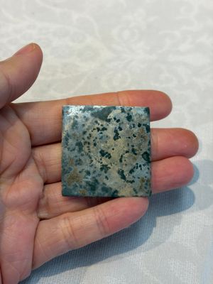 A small Chinese metal-alloy square mirror with relief design, Tang — photo 3