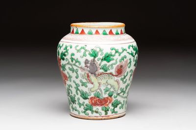 A small Chinese wucai 'Buddhist lion and peony scrolls' jar, Transitional period