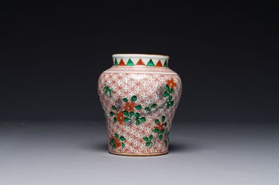 A small Chinese wucai jar with floral design, Transitional period