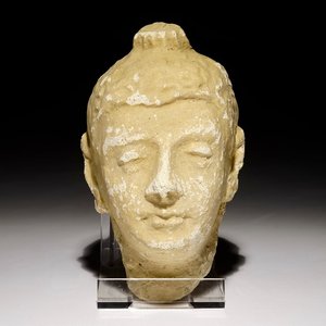 A small stucco head of Buddha, prob. Gandhara, India, 10/11th C. — photo 1