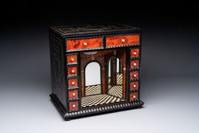 A small tortoiseshell-veneered cabinet of drawers with mirrored interior, Antwerp, 17th C.