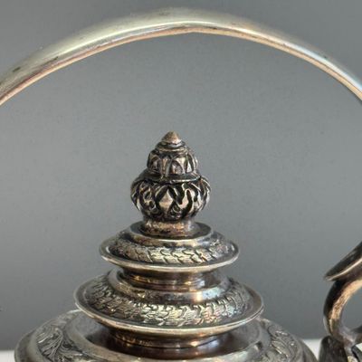 A South-East Asian repoussé silver teapot and a covered box — photo 5