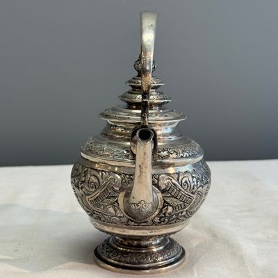 A South-East Asian repoussé silver teapot and a covered box — photo 7