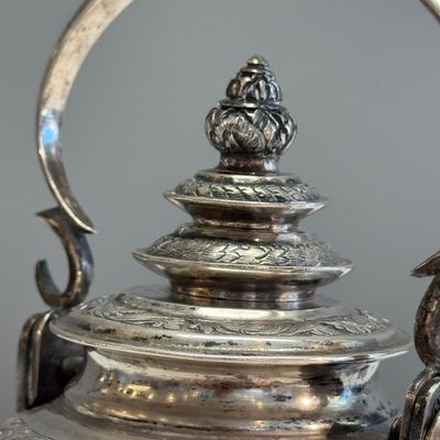 A South-East Asian repoussé silver teapot and a covered box — photo 10