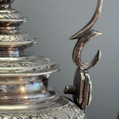 A South-East Asian repoussé silver teapot and a covered box — photo 12