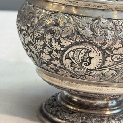 A South-East Asian repoussé silver teapot and a covered box — photo 15