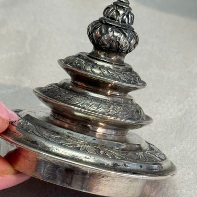 A South-East Asian repoussé silver teapot and a covered box — photo 21