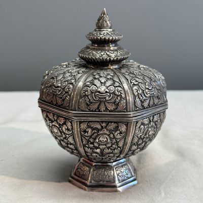 A South-East Asian repoussé silver teapot and a covered box — photo 28