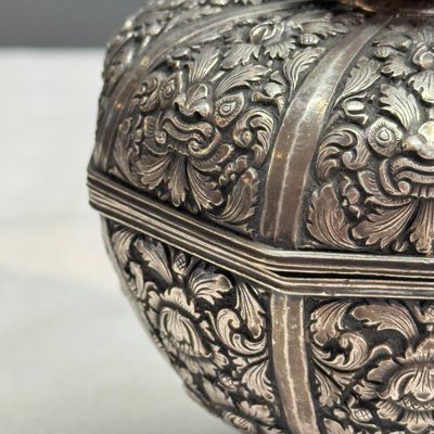 A South-East Asian repoussé silver teapot and a covered box — photo 29
