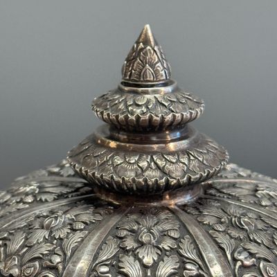 A South-East Asian repoussé silver teapot and a covered box — photo 30