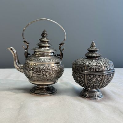 A South-East Asian repoussé silver teapot and a covered box — photo 1