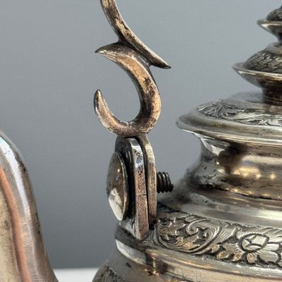 A South-East Asian repoussé silver teapot and a covered box — photo 3