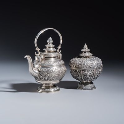 A South-East Asian repoussé silver teapot and a covered box, 19/20th C.