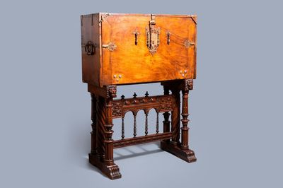 A Spanish bronze-mounted oak 'bargueño' or cabinet on stand, 16th C.