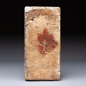 A Spanish cold-painted 'Socarrat' or ceiling tile with stylised floral design, 15th C. — photo 1