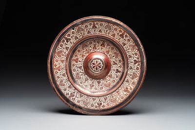 A Spanish Hispano-Moresque lustre-glazed dish with raised central medallion, Manises, 16th C.