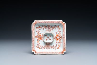 A square Chinese iron-red and gilt trembleuse cup stand with floral design, Jiajing mark, Kangxi
