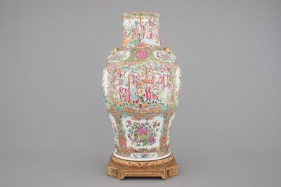 A tall Chinese Canton rose medallion porcelain vase on gilt wood stand, 19th C.