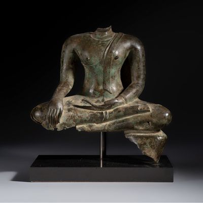 A Thai bronze seated Buddha torso on a later stand, Ayutthaya period, 16/17th C.