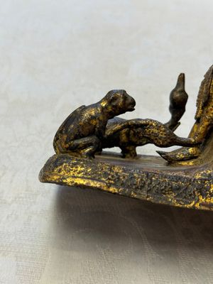 A Thai gilt-bronze figure of a seated deity with attendant animals, 19th C. — photo 8