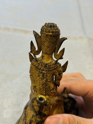A Thai gilt-bronze figure of a seated deity with attendant animals, 19th C. — photo 9