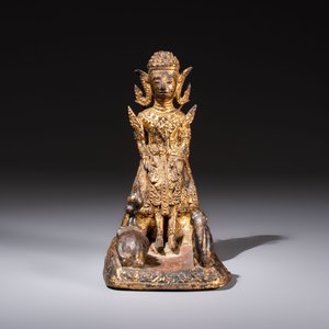 A Thai gilt-bronze figure of a seated deity with attendant animals, 19th C. — photo 2