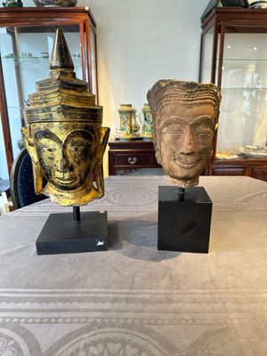 A Thai red sandstone head of Buddha and a lacquered and gilt stone head of Buddha, possibly Ayutthaya period, 15th C. — 照片 1