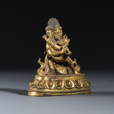 A Tibetan gilt-copper alloy group of Yogambara and Jnana Dakini, 18/19th C.