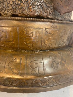 A Tibetan or Nepalese turquoise-inlaid partly-gilt bronze figure of White Tara, 20th C. — photo 1
