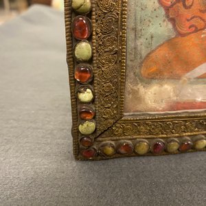 A Tibetan thangka in inlaid gilt brass frame, 19th C. — photo 12