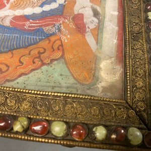 A Tibetan thangka in inlaid gilt brass frame, 19th C. — photo 13