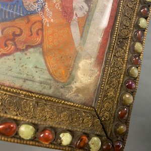 A Tibetan thangka in inlaid gilt brass frame, 19th C. — photo 14
