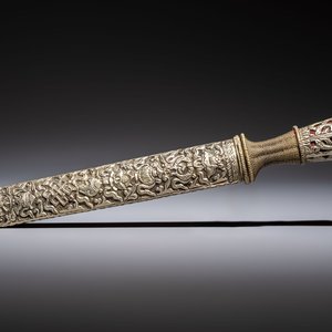 A Tibetan white metal 'Buddhist Symbols' dagger and scabbard, first half 20th C. — photo 1