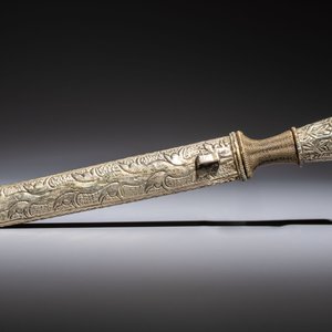 A Tibetan white metal 'Buddhist Symbols' dagger and scabbard, first half 20th C. — photo 2