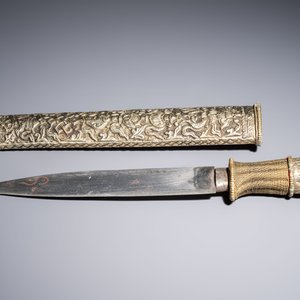 A Tibetan white metal 'Buddhist Symbols' dagger and scabbard, first half 20th C. — photo 3