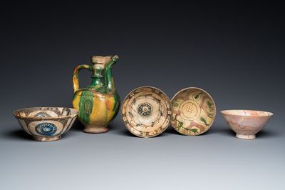 A Turkish Canakkale green- and yellow-glazed ewer and four Islamic pottery bowls, 15th C. and later