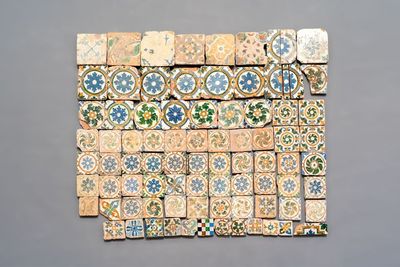 A varied collection of 84 polychrome Spanish tiles with floral design, 15/17th C.