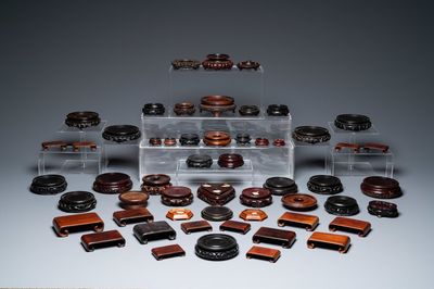A varied collection of Chinese wooden stands, 19/20th C.