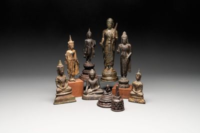 A varied collection of eight bronze Buddha figures, South Asia, 18/19th C.