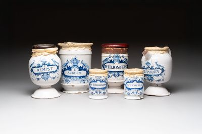 A varied collection of five blue and white faience pharmacy jars and a wet drug jar, Delft, Brussels and Lille, 18th C.