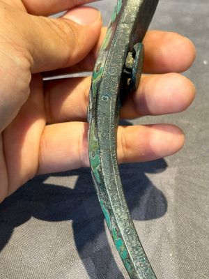 A varied collection of six Chinese bronze belt hooks, Warring States period and Western Han — photo 14