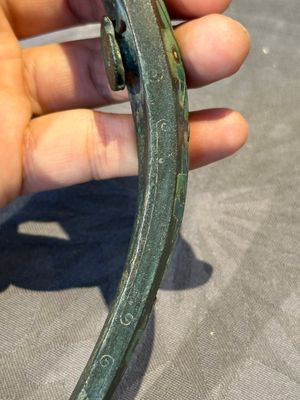 A varied collection of six Chinese bronze belt hooks, Warring States period and Western Han — photo 18
